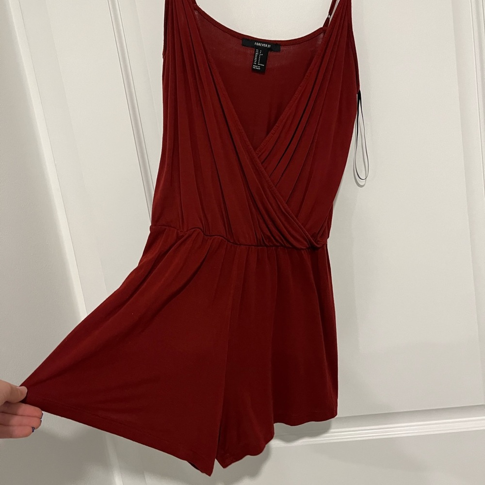 Burgundy romper. Deep v neck